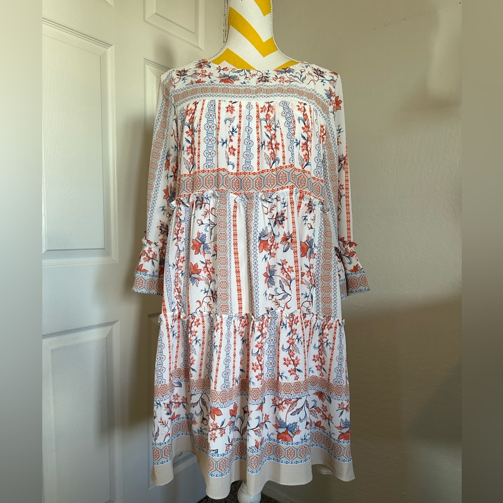 Spring floral tiered and 3/4 bell sleeved dress.